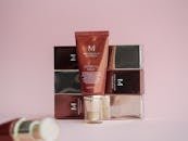 Stylish display of Missha Perfect Cover BB Cream on pink background with packaging.